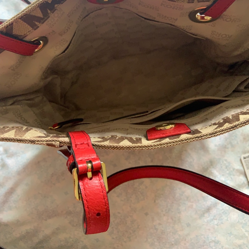 Michael Kors signature tote. Red leather handles.